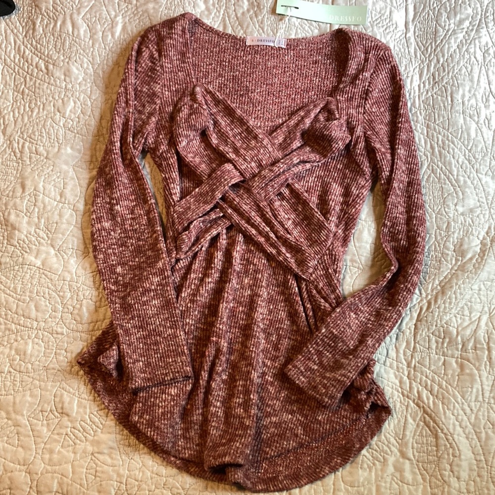 Women’s size small, long sleeve shirt with cross panel details on front of shirt